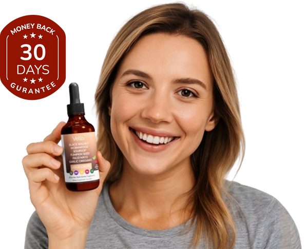 Smiling woman holding softgel